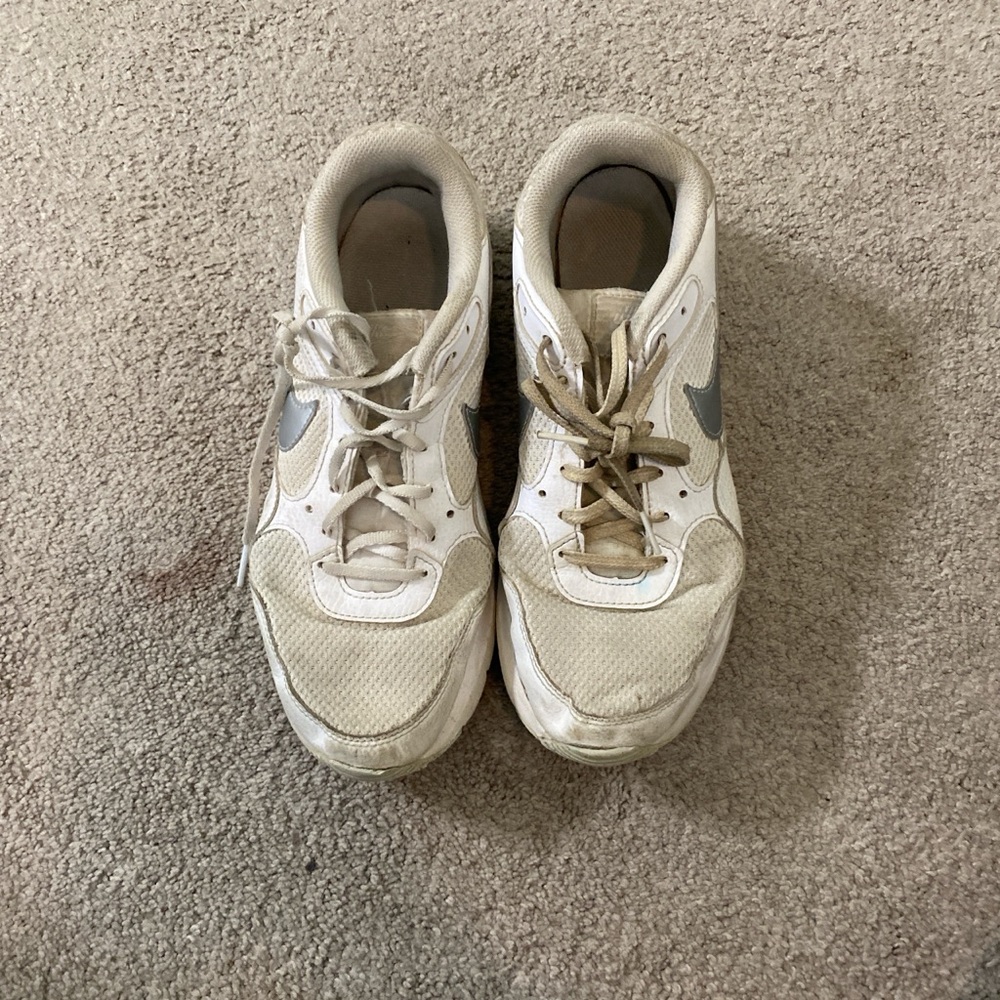 Very noticeably worn air, max Nike, tennis shoes and a size 9 1/2 in women's